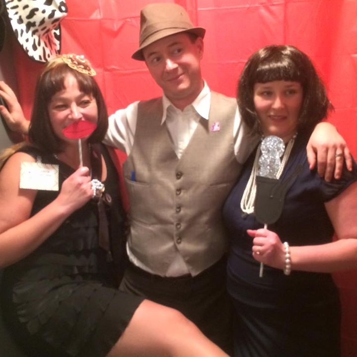 Three costumed guests