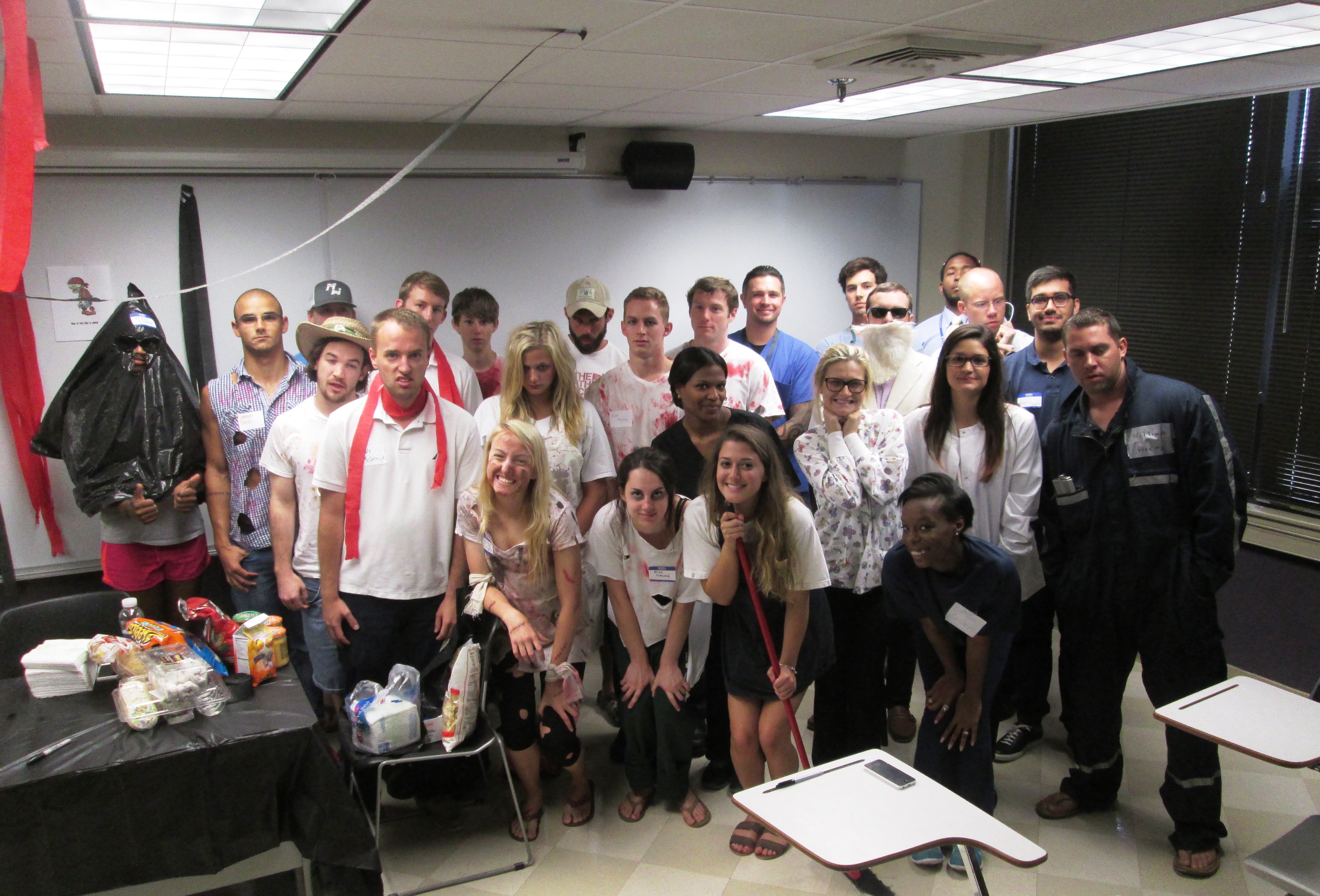 Group shot of class for zombie-themed murder mystery party